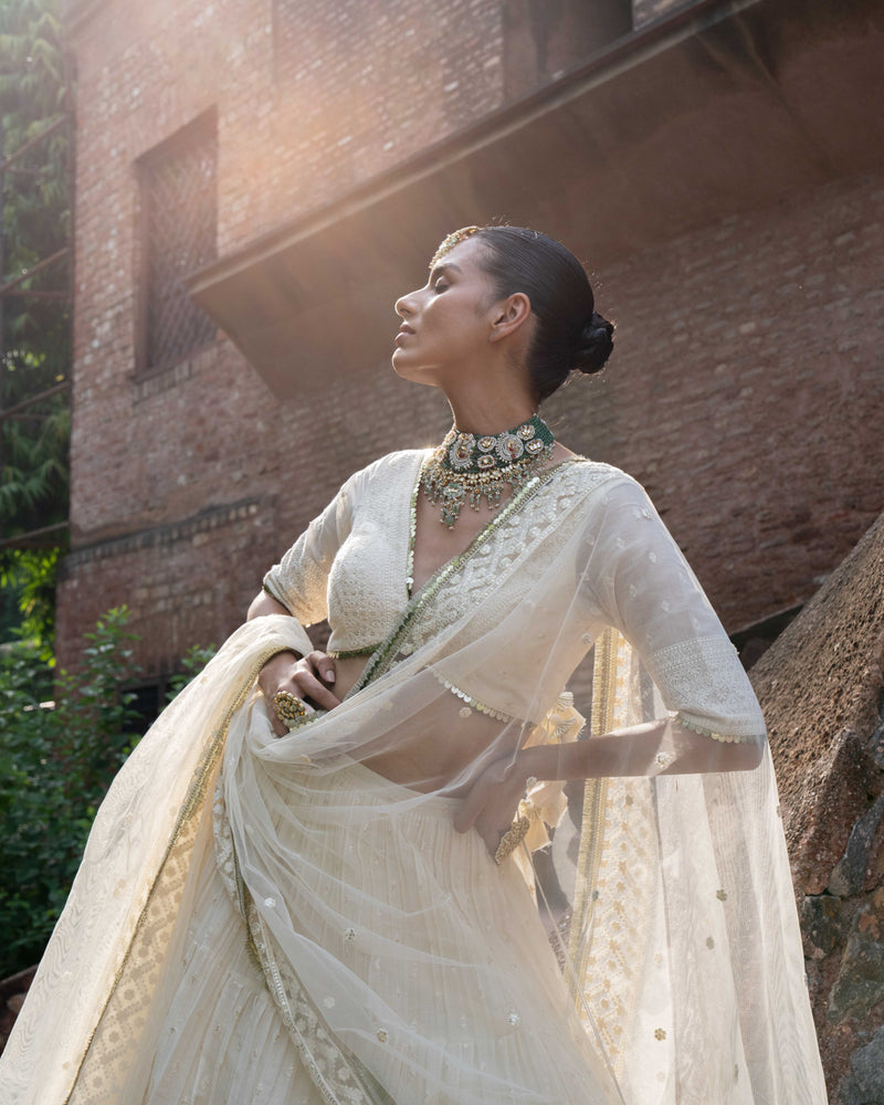 gold & off white big border Lehenga with Embroidered Dupatta
